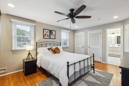 a bedroom with a bed and a ceiling fan at The Chill Pad Deluxe in Cherry Hill in Cherry Hill