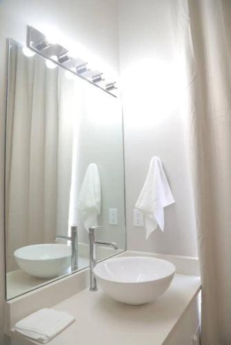 a bathroom with a sink and a large mirror at Canyon Mesa Haven, Luxury Stay near Lake Powell in Big Water
