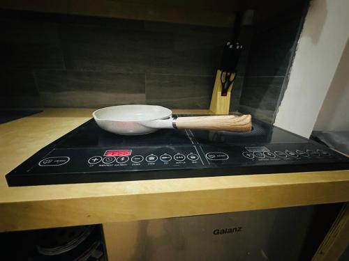 a mortar and pestle sitting on top of a stove at The Stay Doña White in Matamoros