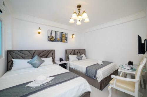 Postel nebo postele na pokoji v ubytování Hotel Costa Vũng Tàu