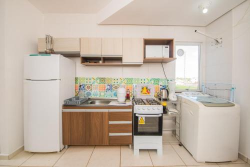 Rental Palhoça- Acomodações Residenciais III tesisinde mutfak veya mini mutfak