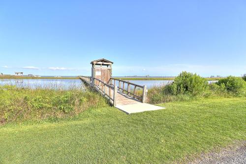 a small wooden bridge over a body of water at Casa de Flip Flops in Rockport