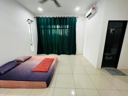 A bed or beds in a room at BOSS Homestay