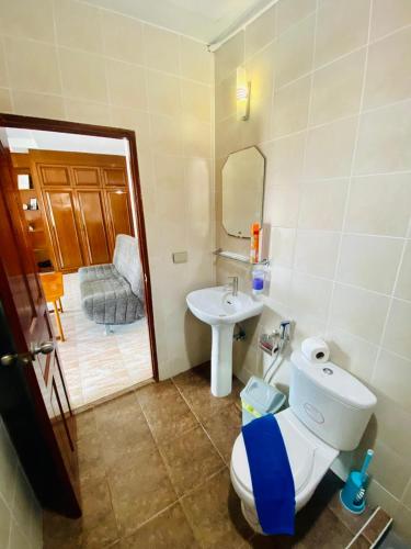 a bathroom with a toilet and a sink at BT hotel Kata Beach in Kata Beach