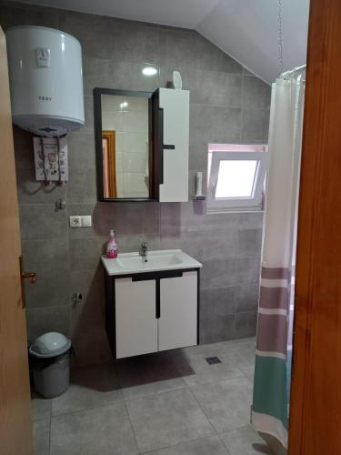 Ένα μπάνιο στο Apartments City Paradise