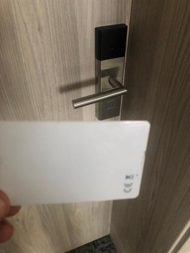a person holding a door handle in a room at Sub Cetate in Râşnov