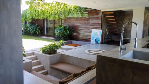 a kitchen with a sink and a counter top at Ocean Villa - Joshua District in Tabanan