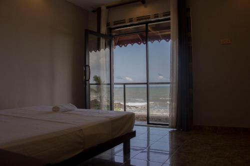 Ένα ή περισσότερα κρεβάτια σε δωμάτιο στο Varinias Beach Villa