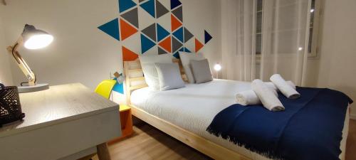 En eller flere senge i et værelse på Chaleureux - Bien équipé - Hypercentre - 2Ch 6pers