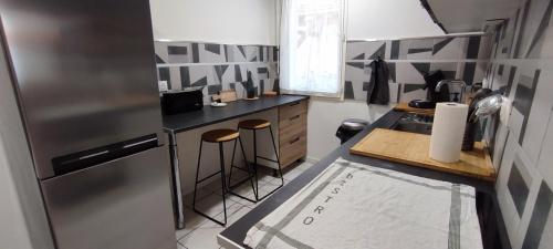 Køkken eller tekøkken på Chaleureux - Bien équipé - Hypercentre - 2Ch 6pers