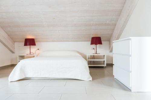 Postel nebo postele na pokoji v ubytování Eco Apartments Cervia