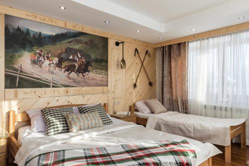 Postel nebo postele na pokoji v ubytování Willa CHWOST-w pobliżu Zakopanego i Term