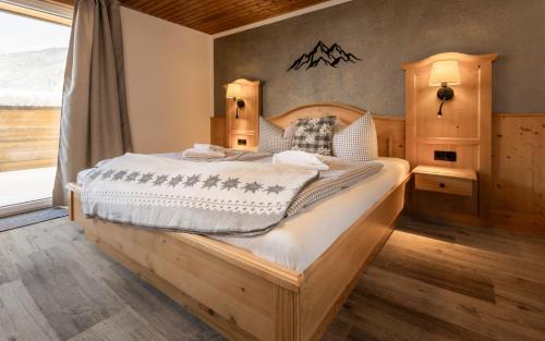 Postel nebo postele na pokoji v ubytování Hotel-Garni Kalkbrennerhof