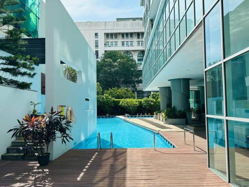 a swimming pool in the middle of a building at Colombo Emperor Residencies in Colombo