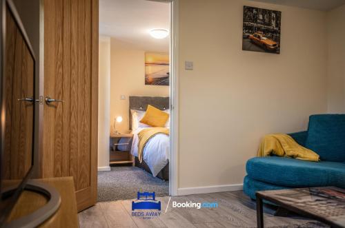 a room with a bedroom with a bed and a mirror at One Bedroom Apartment By Beds Away Short Lets & Serviced Accommodation in North Oxford With Free Wifi in Oxford