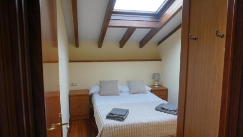 a bedroom with a bed and a skylight at San Pedro by Basquelidays in Hondarribia