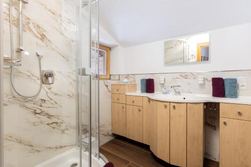 a bathroom with a shower and a sink at Ferienwohnungen Oberstdorf Schwartges in Oberstdorf