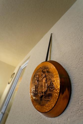 a wooden object with a picture on a wall at ȘURA LU' PĂTRU in Vulcan