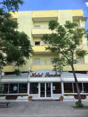 a building with a sign that reads hotel courtyard at Hotel Sandra in Gatteo a Mare
