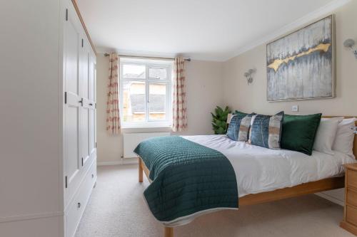 a bedroom with a large bed and a window at Central 1 Bedroom Apartment with Parking 