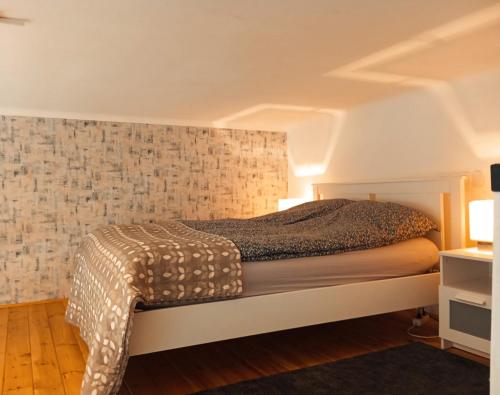 Postel nebo postele na pokoji v ubytování Cozy studio in central Budapest near ruined bars