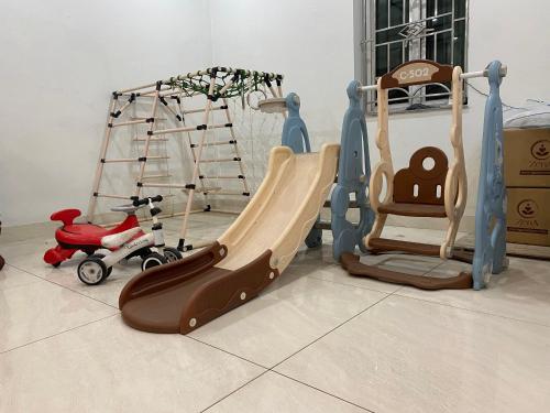 two childrens play equipment in a living room at Đức Hiếu 1 in Hanoi
