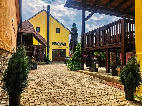 a yellow building with a sign that reads phoenix at Pivovar Pod Lípou Kyšice in Kyšice