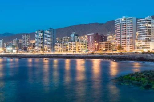 a view of a city with a river and buildings at Dpto excelente ubicación con estacionamiento incluido in Antofagasta