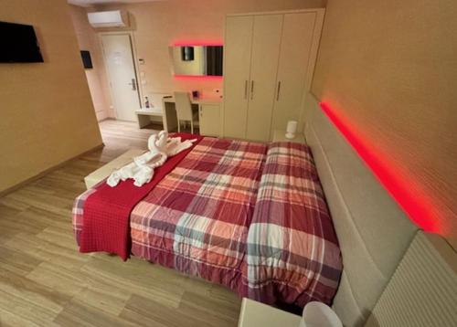 a bedroom with a bed with a stuffed animal on it at Locanda LaRotonda in Villa Verucchio
