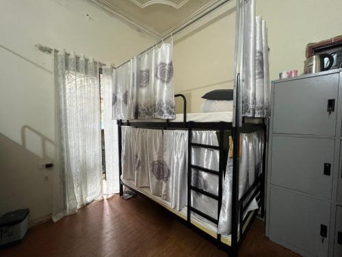 a room with a bunk bed in a room at NHÀ AN in Hanoi