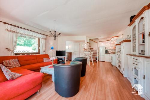 a living room with a couch and a table at Sonnenhaus in Frauenstein