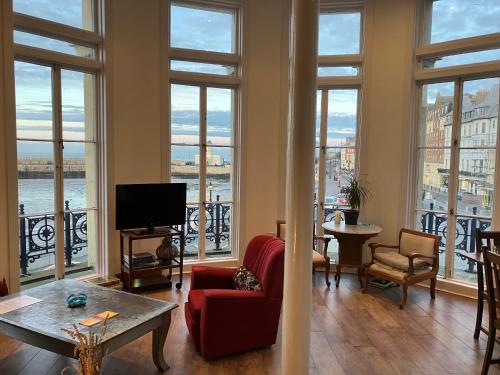 a living room with a view of the water at Imperial House "Serviced Apartments" in Margate