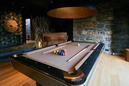 a pool table with balls on it in a room at OKLM in Stavelot