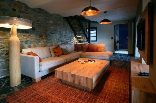 a living room with a couch and a coffee table at OKLM in Stavelot