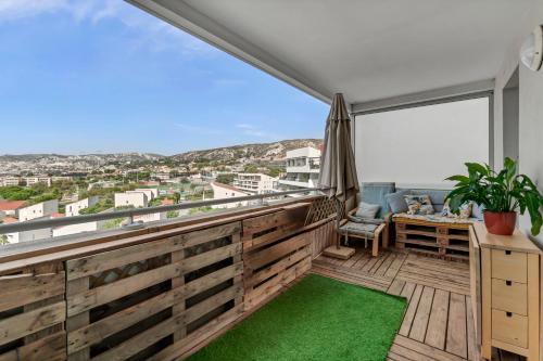 a balcony with a view of the city at Room in Appartment with seaview in Marseille