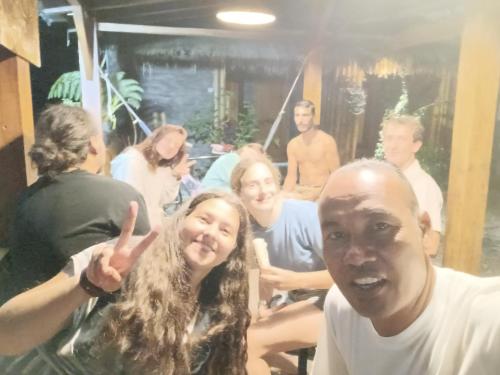 a group of people standing in a room at Dira Bungalows in Tetebatu