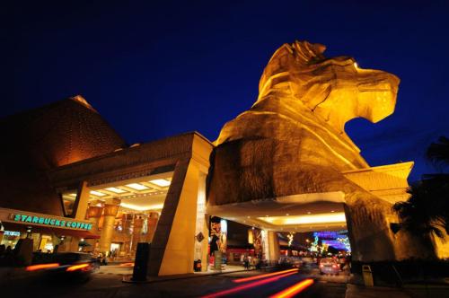 a statue of a lion in front of a building at One Dream Hotel in Petaling Jaya