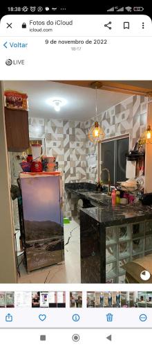 a picture of a kitchen with a counter top at Casa de veraneio garatucaia in Angra dos Reis