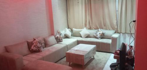 a living room with a couch and a table at Studio Zenith in Casablanca