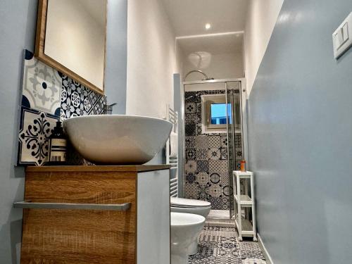 a bathroom with a sink and a toilet at Charm & History in Trieste in Trieste