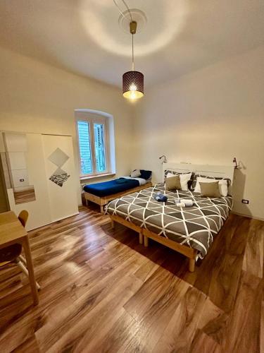 a bedroom with a large bed in a room at RESIDENCE ZAR 4 in Trieste
