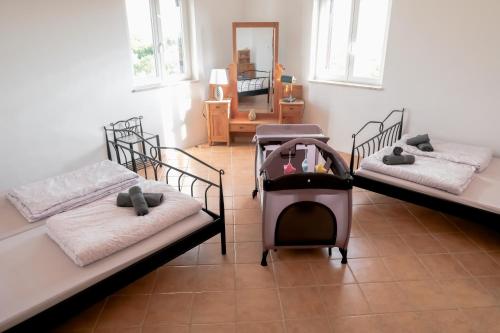 a room with two bunk beds and a mirror at Villa Garica in Garica