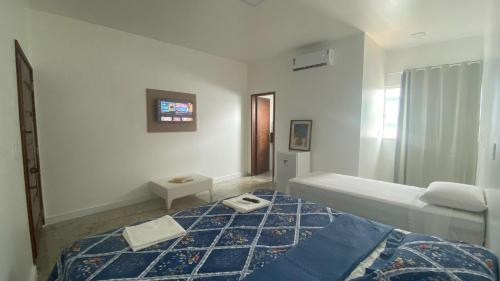 a bedroom with two beds in a room at Terra das Palmeiras in Barreirinhas