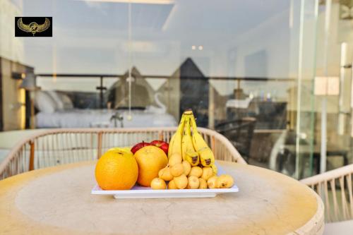a plate of fruit sitting on a table at Comfort Inn Giza in Cairo