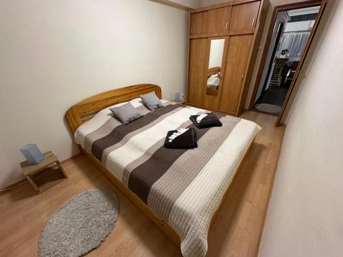 Posteľ alebo postele v izbe v ubytovaní Central Apartman Makó