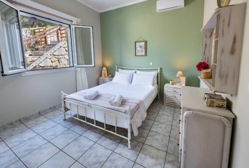 Postel nebo postele na pokoji v ubytování Villa Estia