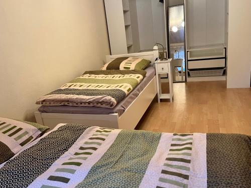 a room with two beds in a room at Monteurwohnung Waldnaab in Altenstadt an der Waldnaab