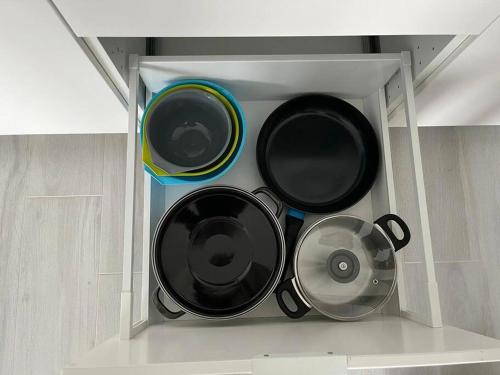 a bunch of pots and pans in a kitchen at Appartement Brussels Airport 2 in Machelen