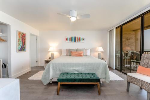 a bedroom with a bed and a ceiling fan at 219 Sea Vista - Beach Front in South Padre Island