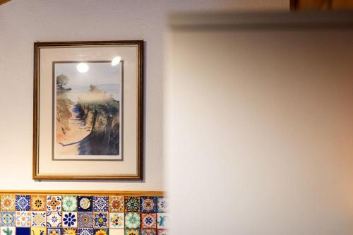 a picture hanging on a wall in a room at Cozy Norwegian Style Log Cabin in Rural Snowdonia - 2 Bedrooms & Parking by Seren Short Stays in Ffestiniog